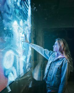 Woman in Front of a Digital Wall