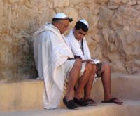 Bar Mitzvah vs. Bat Mitzvah: Father Teaching His Son